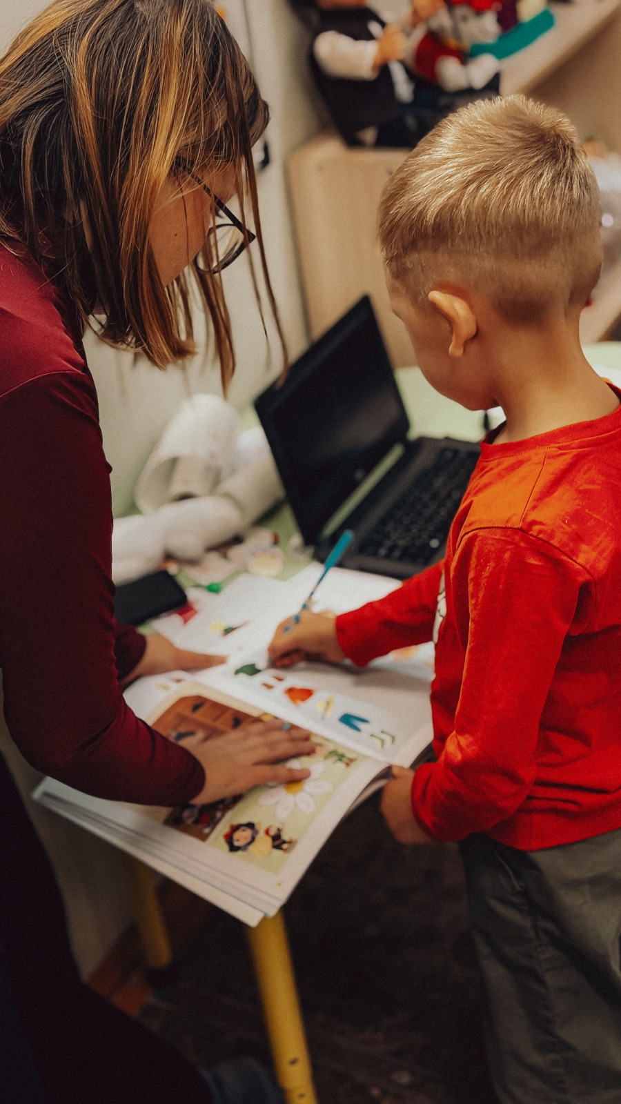 Therapist working one-on-one with a child on a learning activity