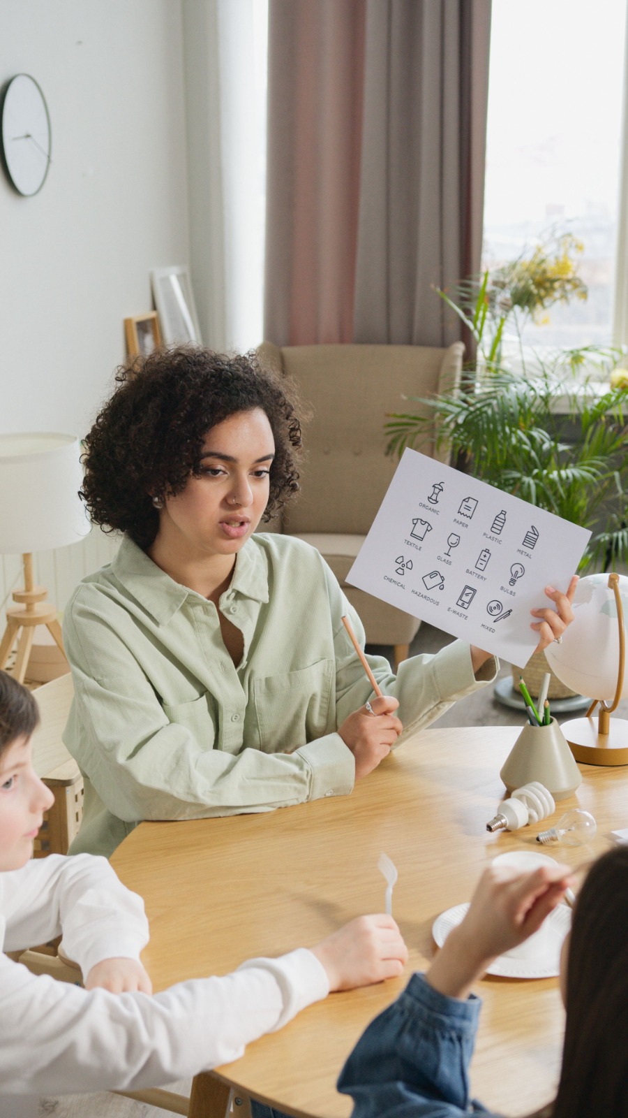 A therapist using visual cards in an enrichment session with a child